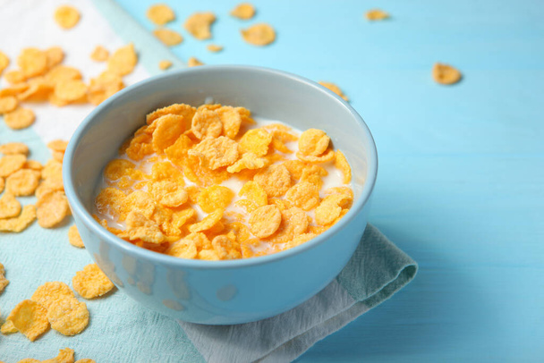  Crispy cornflakes with milk for breakfast on the table close-up. - Photo, Image