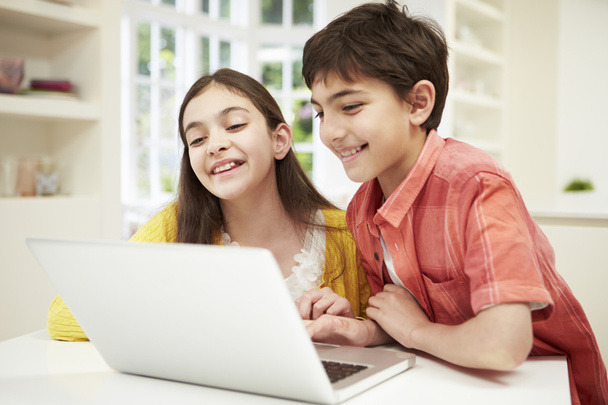 Two Hispanic Children Looking at Laptop - Photo, image