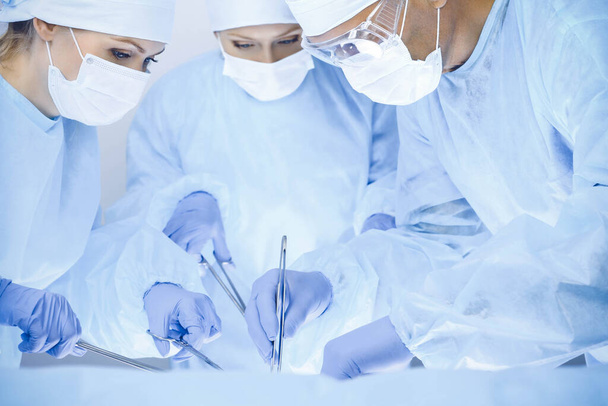 A group of surgeons is operating at the hospital. Health care concept - Foto, immagini