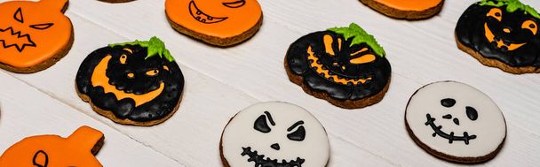 high angle view of homemade and tasty halloween cookies on white surface, banner - Photo, Image