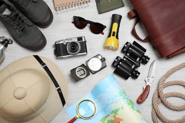 Flat lay composition with safari accessories on white wooden background - Fotoğraf, Görsel
