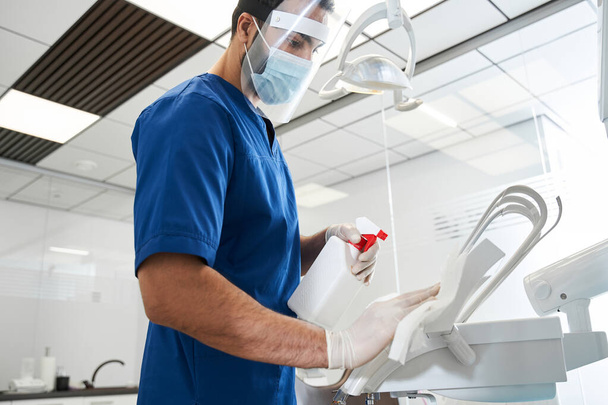 Dentist sterilize the medical equipment inside a dental clinic - Foto, Imagem