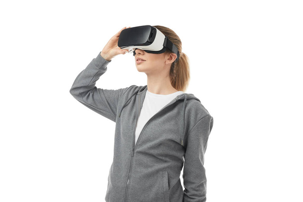 Woman in headset exploring virtual reality - Photo, Image