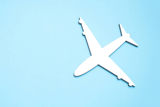 Picture of airplane isolated on empty blue background - Foto, afbeelding
