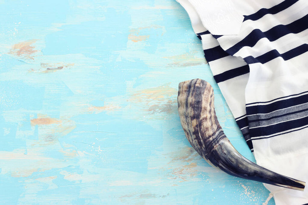 religion image of shofar (horn) on white prayer talit. Rosh hashanah (jewish New Year holiday), Shabbat and Yom kippur concept - Photo, Image