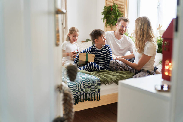 Family spending Christmas morning together - Photo, Image
