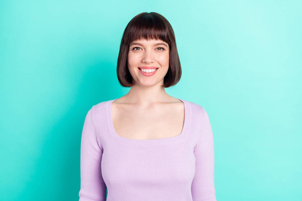 Photo portrait woman with bob hair smiling in casual outfit isolated bright teal color background - Fotó, kép