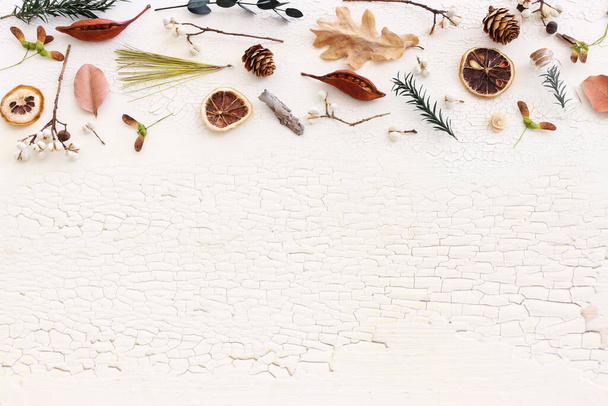 Top view image of autumn forest natural composition over wooden white background .Flat lay. Banner - Fotó, kép