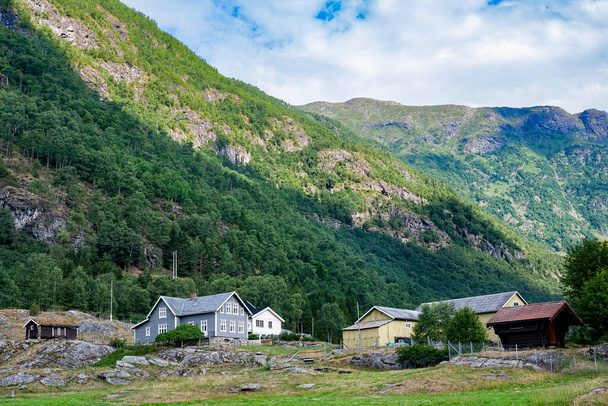 Farmhouses in a valley in the mountains near Sognefjord, Norway - 写真・画像