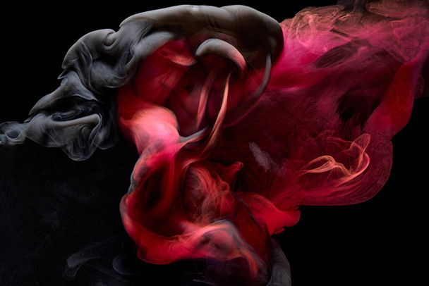 Red black pigment swirling ink abstract background, liquid smoke paint underwater - Valokuva, kuva