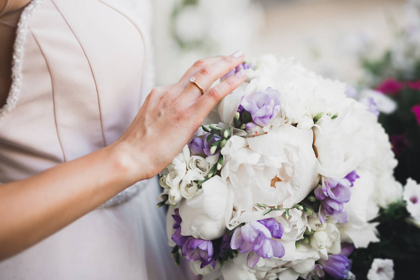 Bride holding big and beautiful wedding bouquet with flowers - Fotografie, Obrázek