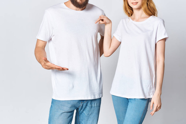 man and woman in white t-shirts cropped view mocap advertisement - 写真・画像