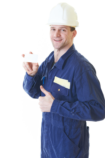 Builder man in blue robe with visit card - Foto, afbeelding