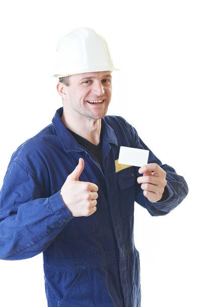 Builder man in blue robe with visit card - Photo, Image