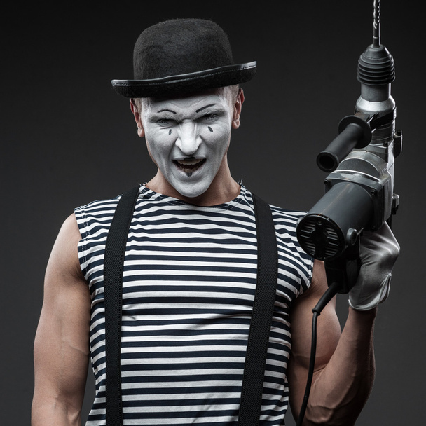 mime with hammer drill - Foto, Bild
