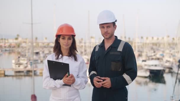 Seafarers man and woman working together in yacht club - Footage, Video