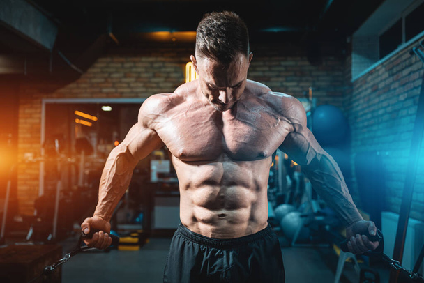 muscular bodybuilder male have workout in gym or training with sport equipment - Φωτογραφία, εικόνα