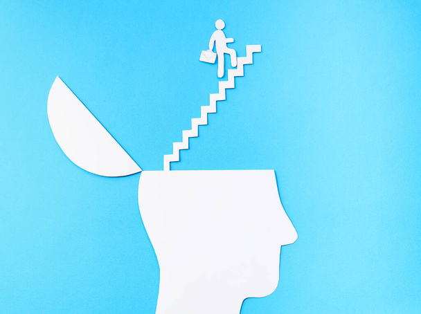 Uplifting and business prosper Concept, Paper Cut Open head with stairs up - Photo, Image