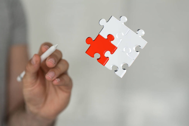 An illustration of the puzzle in a hand as a business solution concept - Fotografie, Obrázek