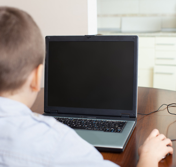 Boy playing a computer - Foto, imagen