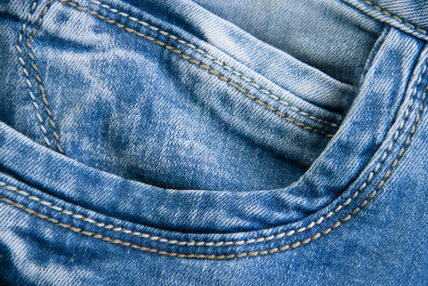 Джинсовая синяя ткань крупным планом фоновый карман - Фото, изображение