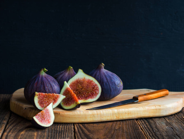 Still life with fresh figs on an old table - Photo, image