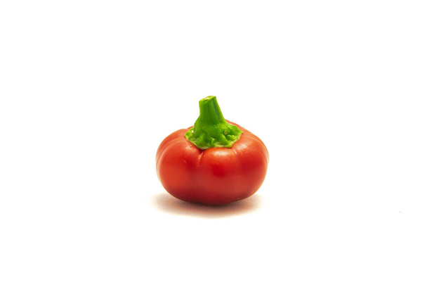 Single red ripe hot cherry pepper or pimiento heart-shaped chili pepper isolated on white - Photo, Image