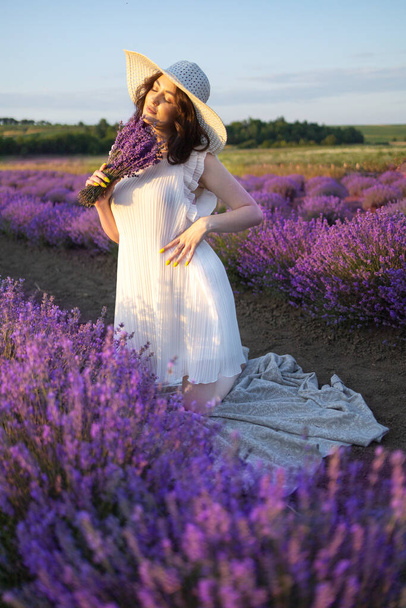 Girl in a sexy dress in lavender Smiling girl in sunset over summer lavenda waiting for groom -Provence - Foto, imagen