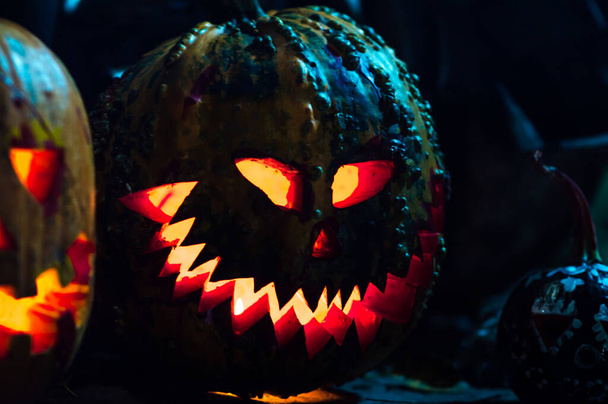 scary art halloween pumpkins in smoke and darkness by candlelight in a scary abandoned place - 写真・画像