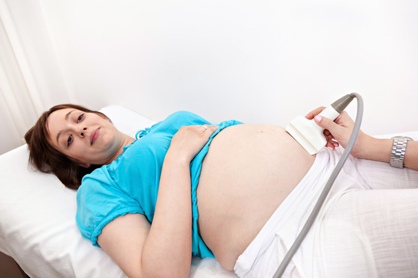 Pregnant Woman At Gynecologist - Foto, immagini