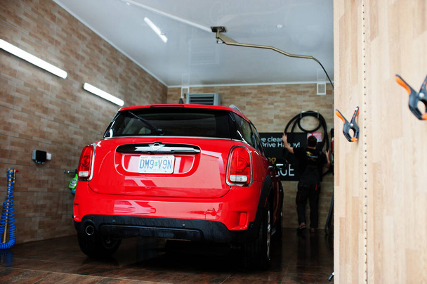 Kyiv, Ukraine - May 14, 2021: Red Mini Cooper Countryman car at detailing garage. - Foto, Bild