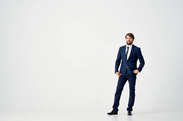 The man in a suit movement Jump light background - Фото, изображение