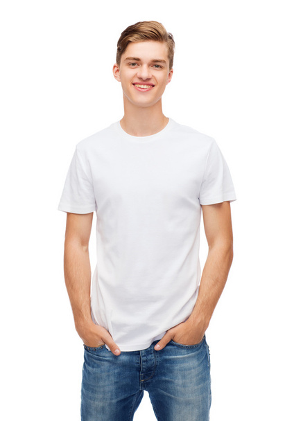 smiling young man in blank white t-shirt - Zdjęcie, obraz