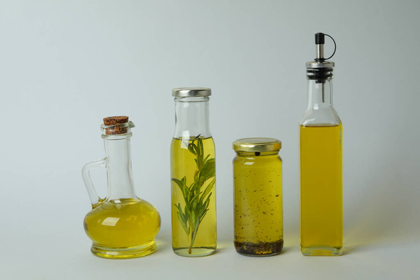 Set of different oils on light gray background - Fotoğraf, Görsel