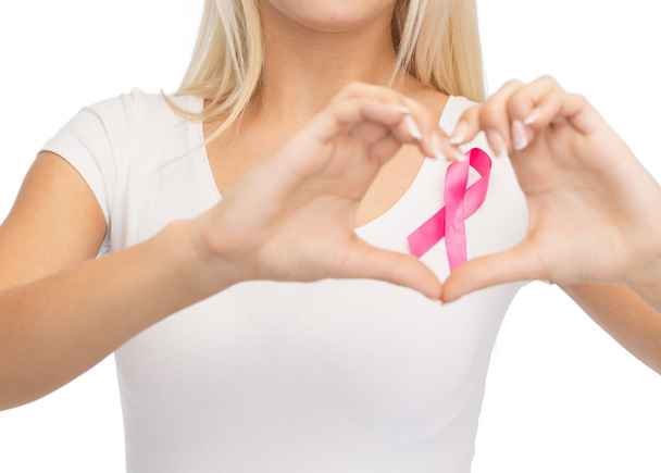 young woman with pink cancer awareness ribbon - Valokuva, kuva
