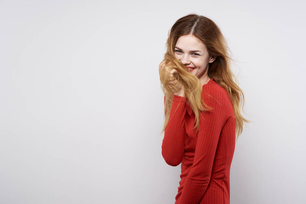 cheerful woman in a red sweater cosmetics emotion isolated background - Valokuva, kuva