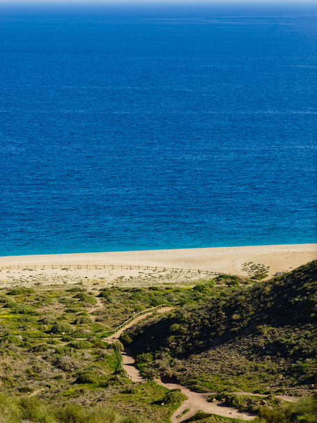 Coastal landscape, walking area path along sandy beach, Cabo de Gata Nijar Natural Park in Spain - Фото, зображення