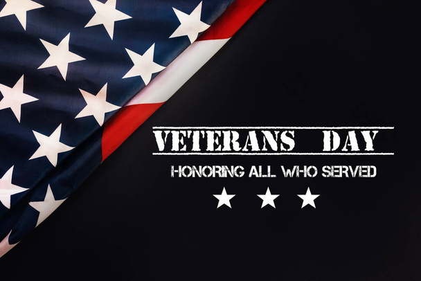 National american holiday banner. Black background with an American flag. Flat lay. The concept of the Veterans Day and patriotism. - Photo, image