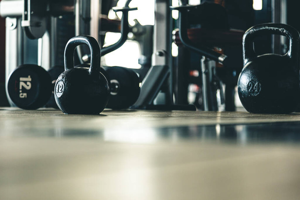 Kettlebells on the background of the interior of the gym without people - Photo, image