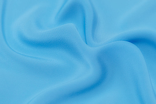 Tessuto blu sfondo texture, tessuto ondulato colore blu morbido, raso di lusso o seta tessitura del panno. - Foto, immagini