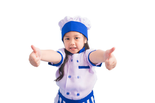 Chicas felices con una sonrisa increíble en la ropa y la gorra del chef. niño sueña con convertirse en un chef. - Foto, Imagen