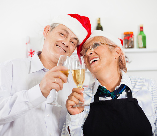 Happy mature couple celebrating Christmas - Photo, Image