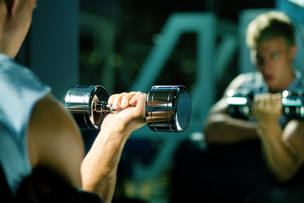 Young with dumbbells, seeing - Photo, image