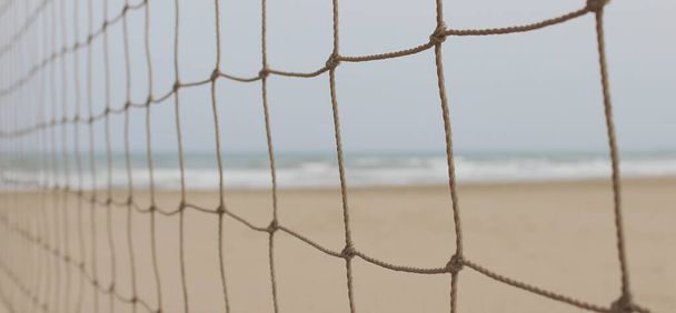 A large volleyball net on a beach - Foto, Imagen