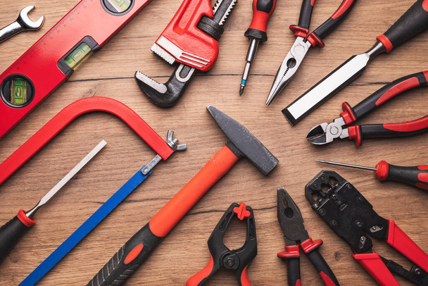 Assorted work tools on wooden background. Construction.xd - Zdjęcie, obraz