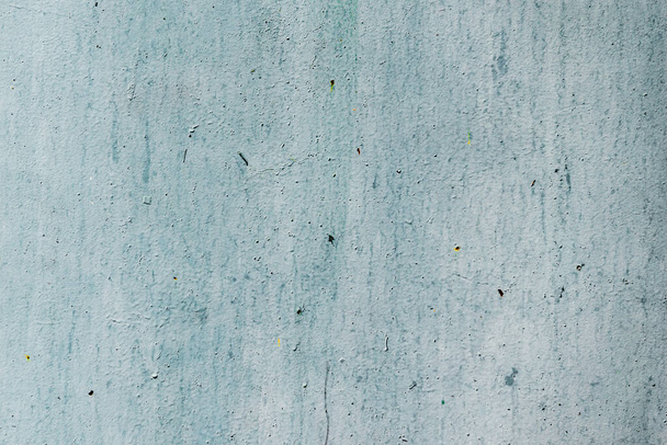 Texture of a metal wall with cracks and scratches which can be used as a background - Fotó, kép