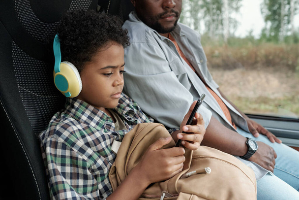 Black Boy Watching Cartoon On Phone - Fotó, kép