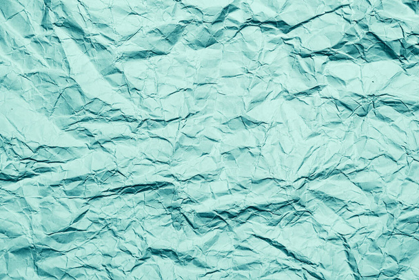 Green crumpled paper background, texture with copy space - Фото, зображення