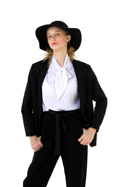 Elegant beautiful girl in a fashionable black suit - Fotografie, Obrázek