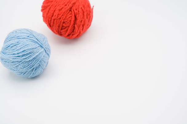 A vertical shot of isolated colorful yarns on a white background with text space - Fotó, kép